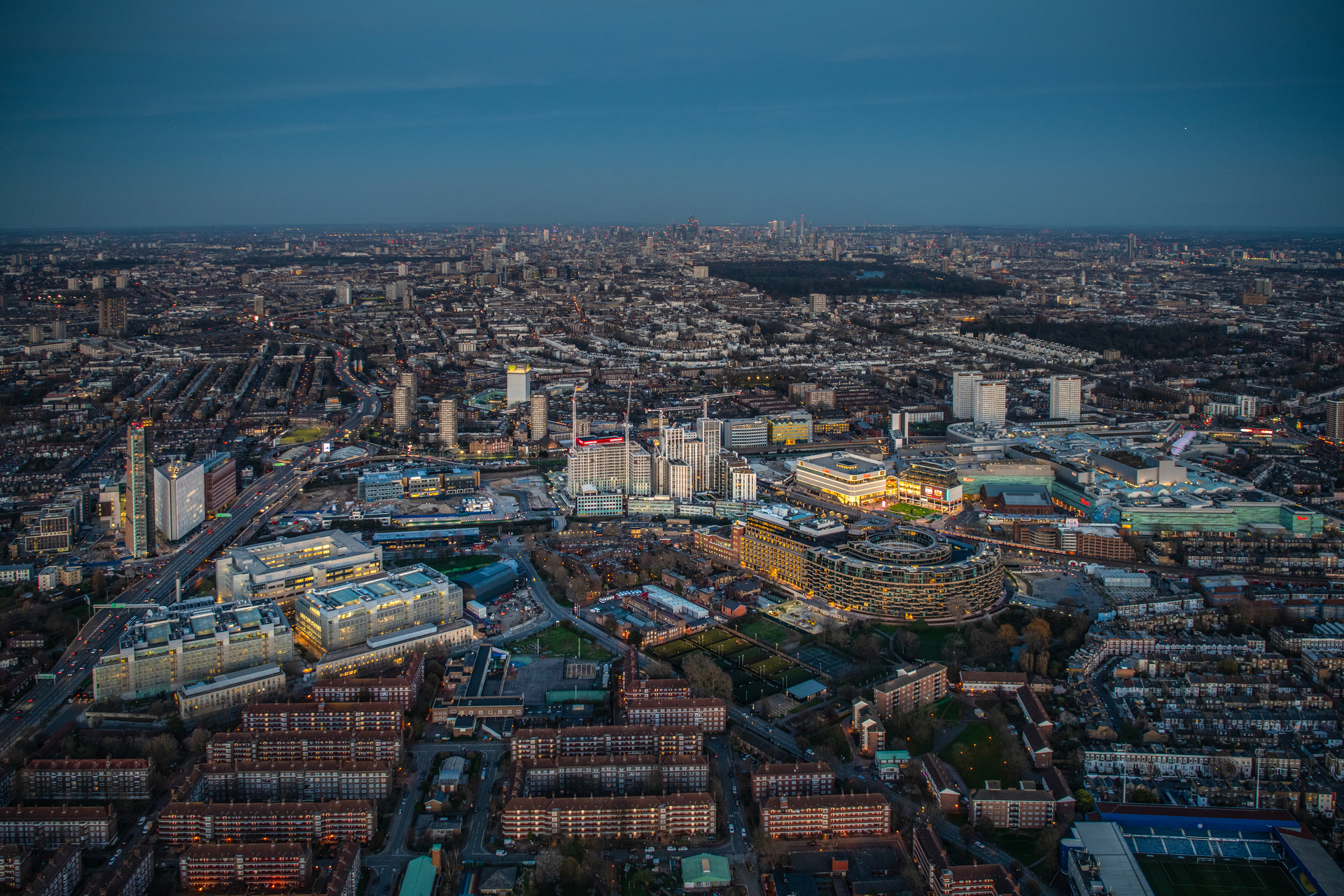 Evening Aerial view of White City, Wood lane, Westfield London, Latimer Road Station, and Television Centre, London.